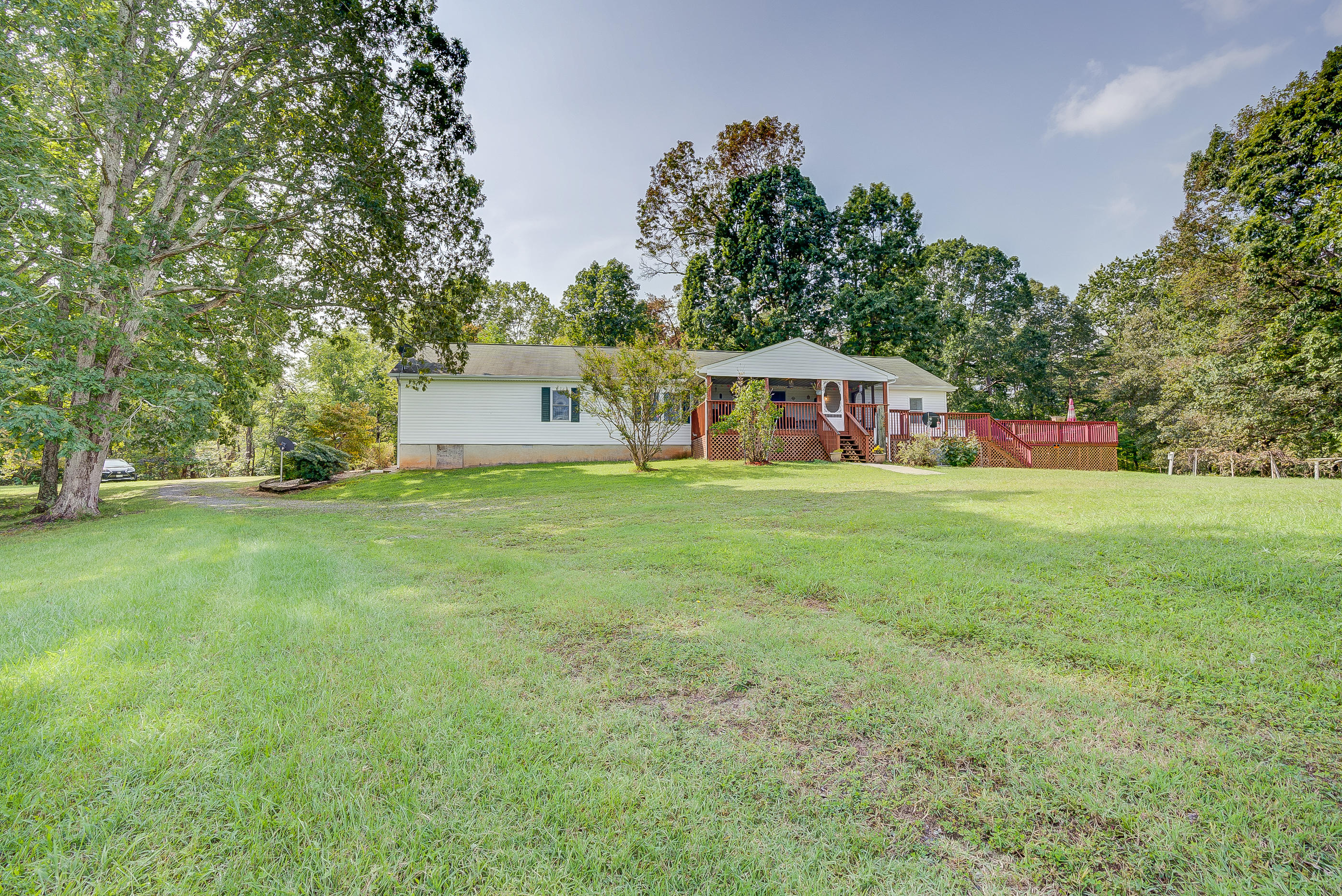1133 Running Deer Ridge, Unit 1083 Goodview, VA 24095 - Photo 28 of 35 a view of house with yard and trees in the background