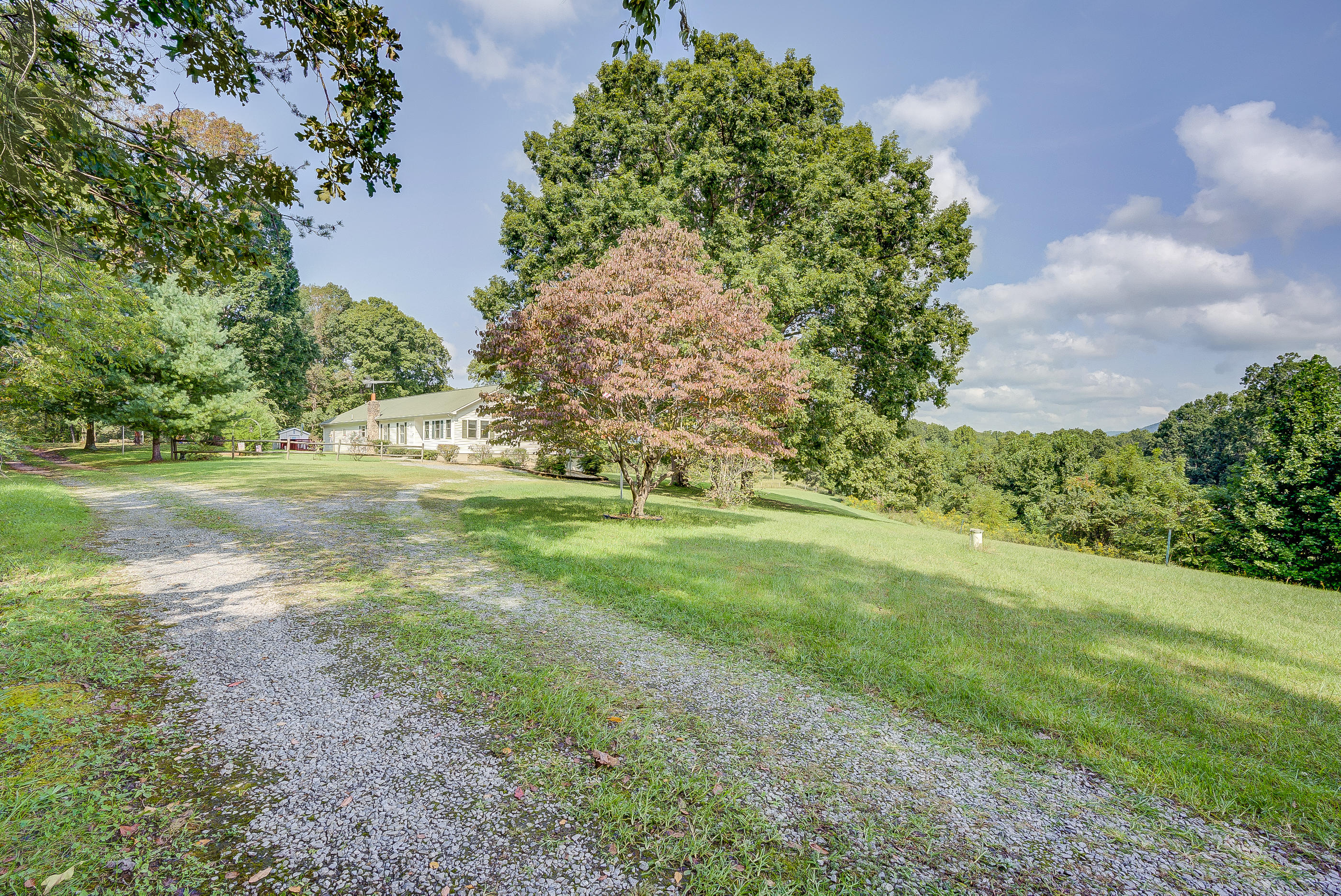 1133 Running Deer Ridge, Unit 1083 Goodview, VA 24095 - Photo 30 of 35 a view of a yard with large trees