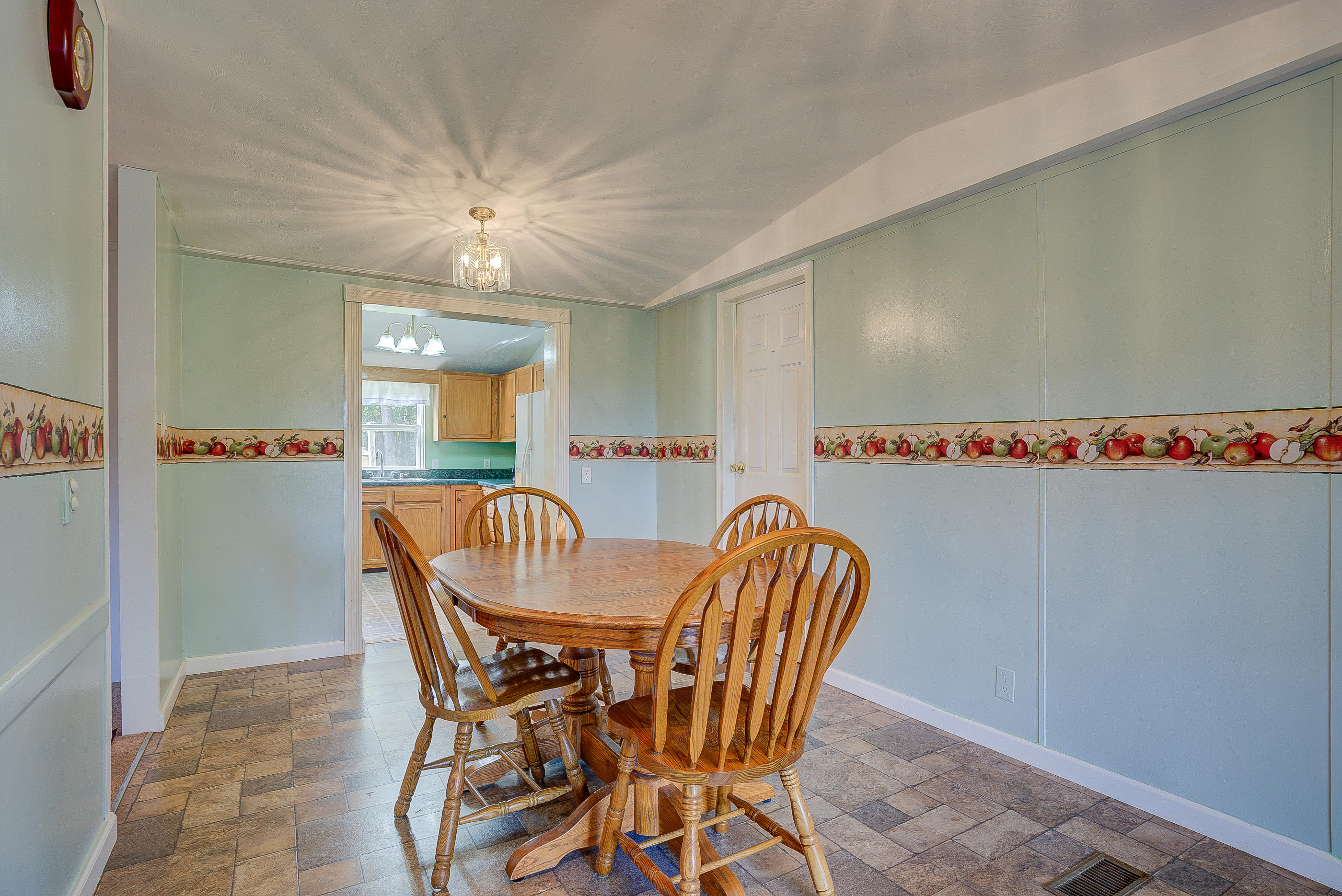 1133 Running Deer Ridge, Unit 1083 Goodview, VA 24095 - Photo 7 of 35 a dining room with furniture and window