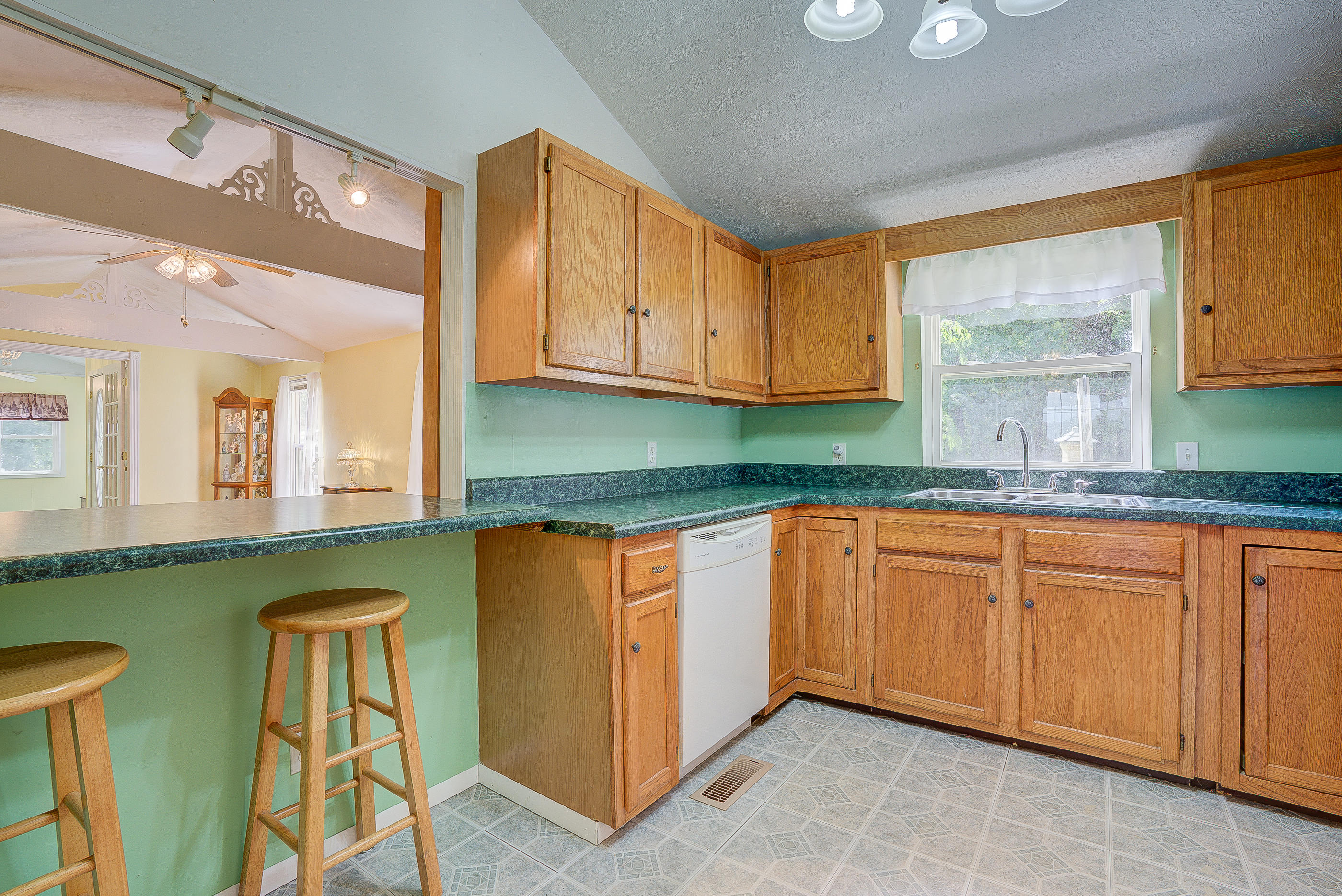 1133 Running Deer Ridge, Unit 1083 Goodview, VA 24095 - Photo 8 of 35 a kitchen with stainless steel appliances granite countertop a sink and a cabinets
