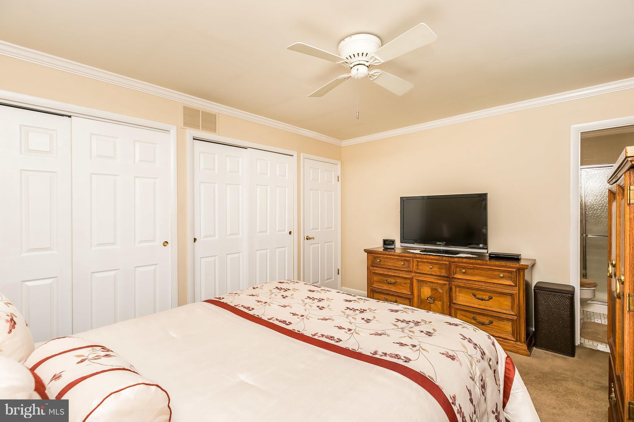 1207 Roxboro Road Baltimore, MD 21237 - Photo 14 of 30 a bedroom with a bed and a flat screen tv