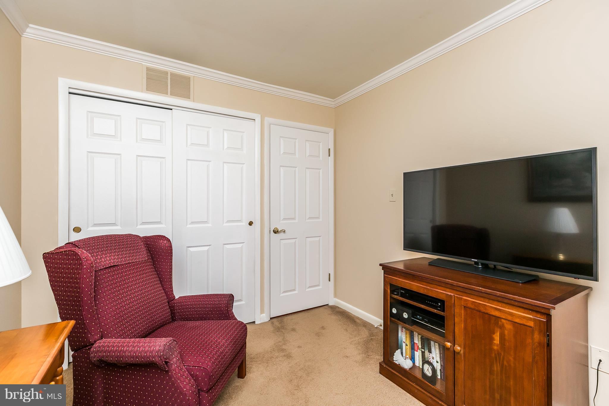 1207 Roxboro Road Baltimore, MD 21237 - Photo 17 of 30 a living room with furniture and a flat screen tv