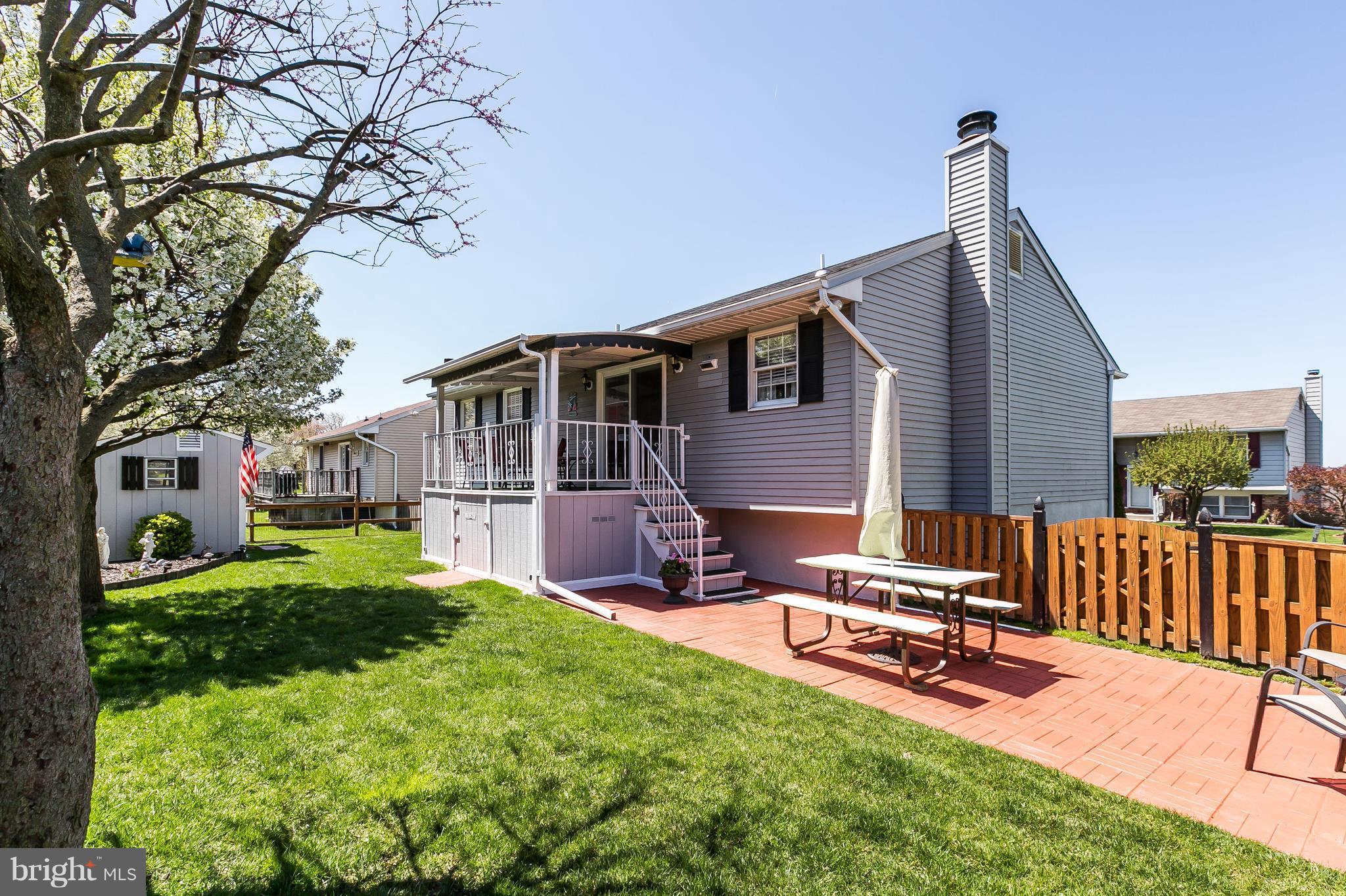 1207 Roxboro Road Baltimore, MD 21237 - Photo 29 of 30 a view of a house with backyard porch and sitting area