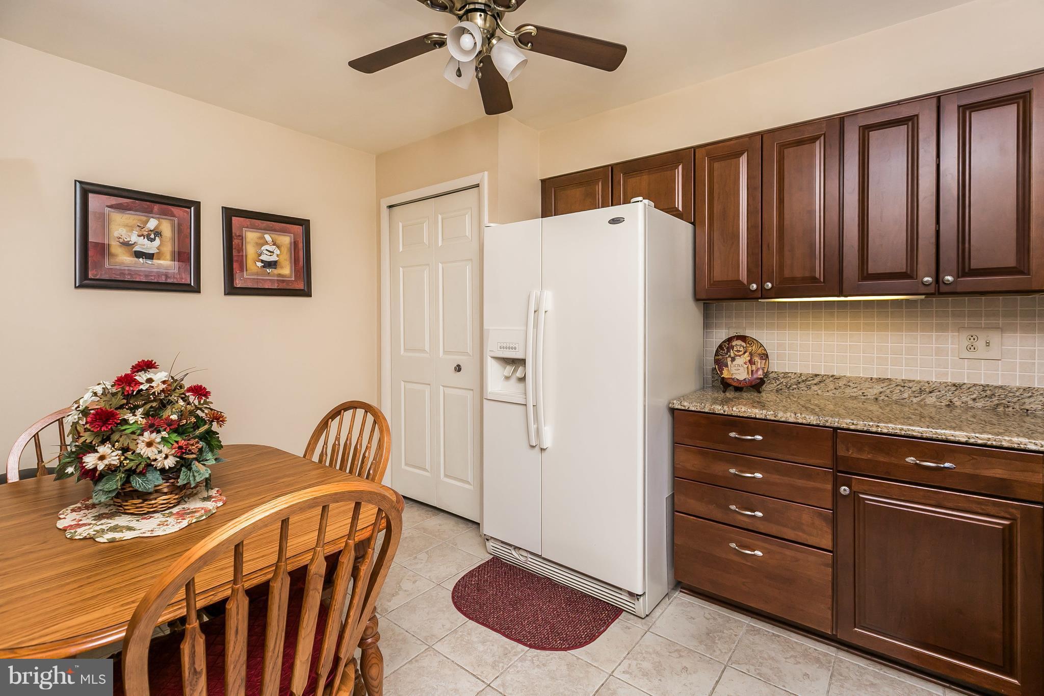 1207 Roxboro Road Baltimore, MD 21237 - Photo 9 of 30 a kitchen with stainless steel appliances granite countertop a refrigerator and a stove