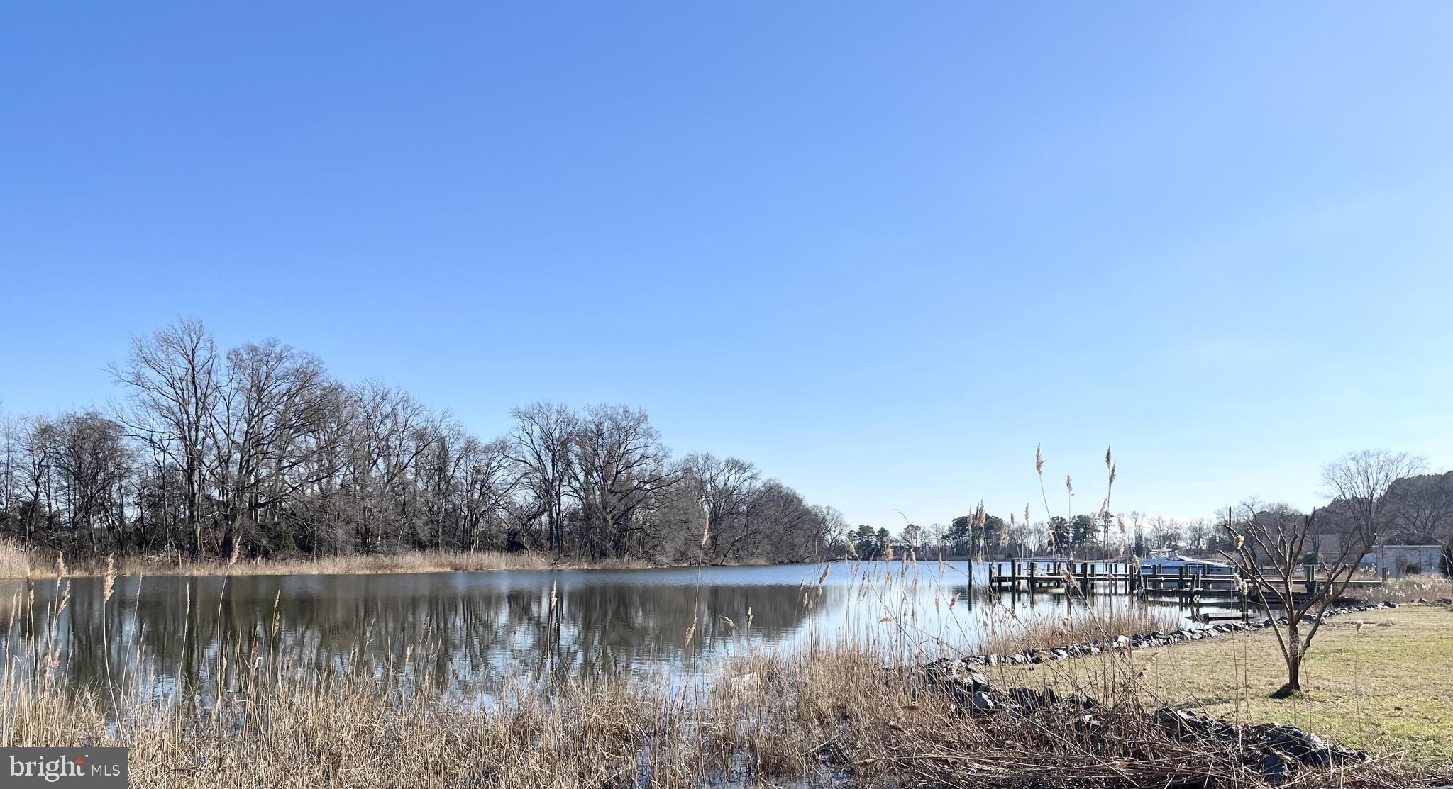 203 Riverside Drive Chester, MD 21619 - Photo 2 of 8 a view of a lake with houses