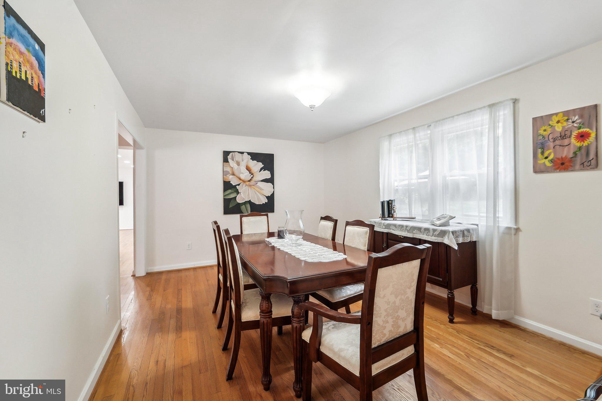 15516 Tierra Drive Silver Spring, MD 20906 - Photo 11 of 62 a view of a dining room with furniture and wooden floor