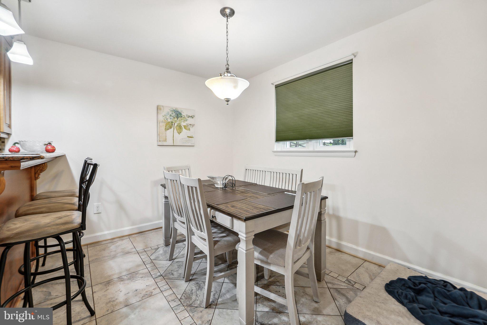 15516 Tierra Drive Silver Spring, MD 20906 - Photo 12 of 62 a view of a dining room with furniture and wooden floor
