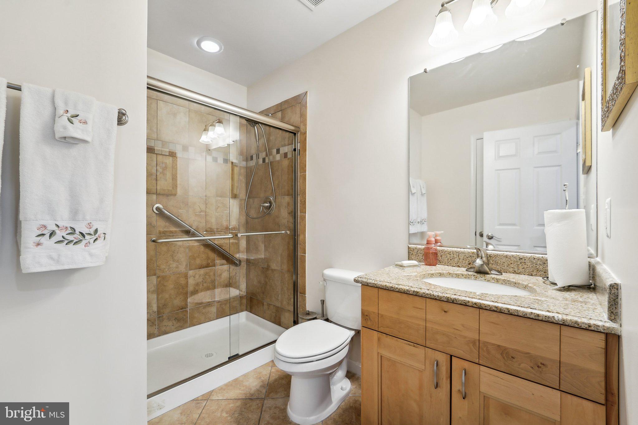 15516 Tierra Drive Silver Spring, MD 20906 - Photo 20 of 62 a bathroom with a sink toilet and shower