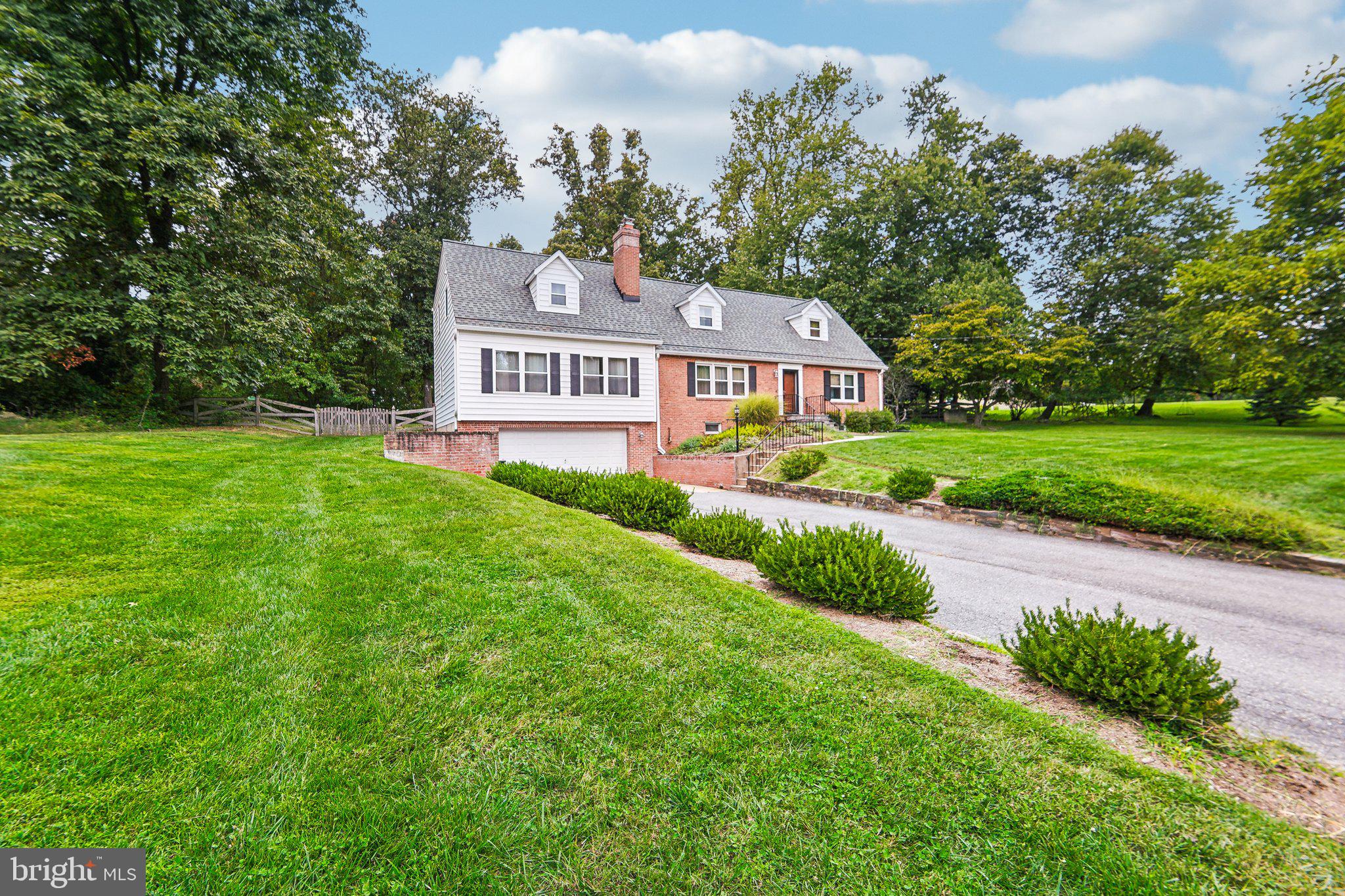 15516 Tierra Drive Silver Spring, MD 20906 - Photo 2 of 62 a front view of a house with a yard and trees