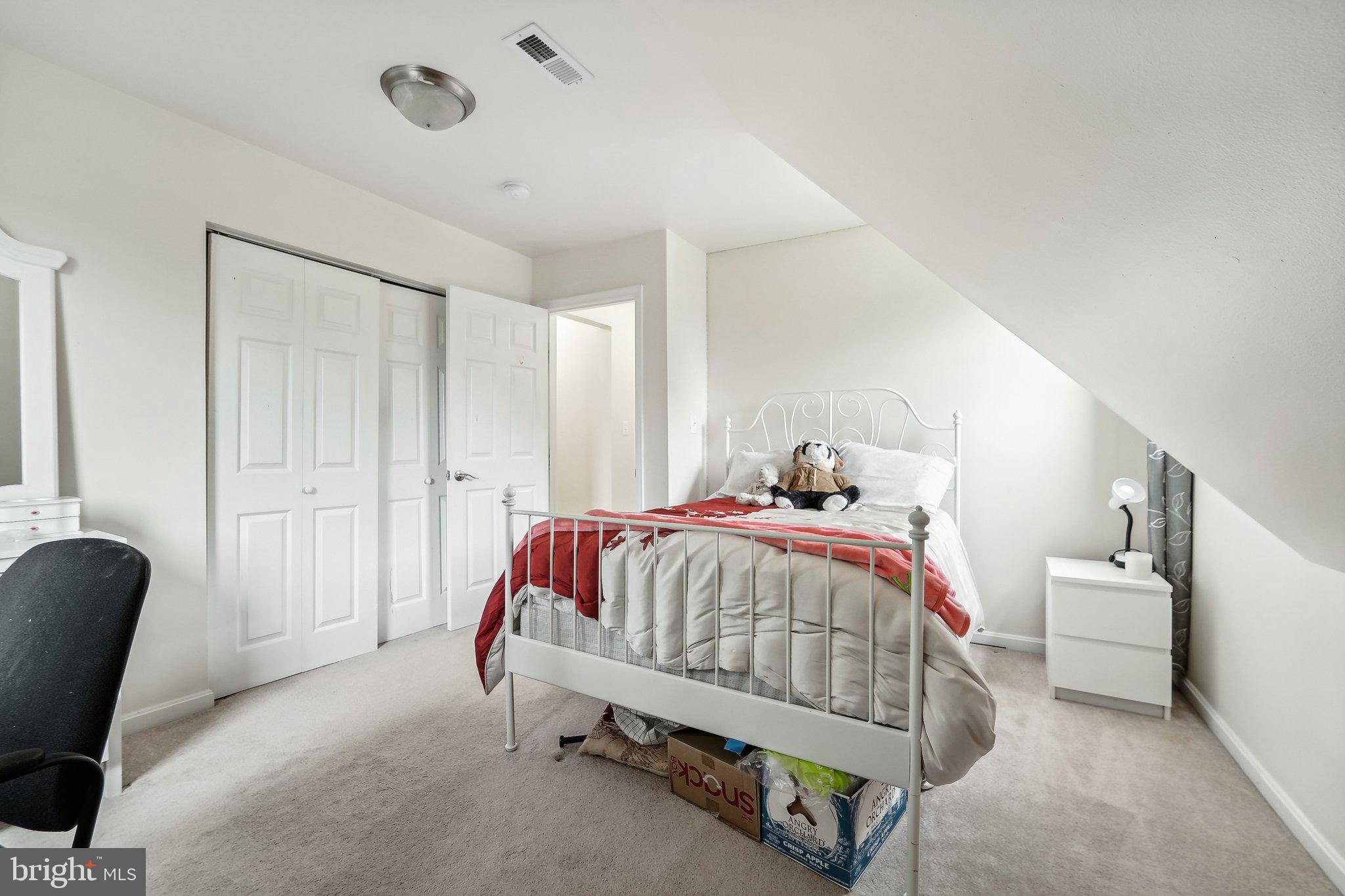 15516 Tierra Drive Silver Spring, MD 20906 - Photo 33 of 62 a bedroom with a bed and a chair