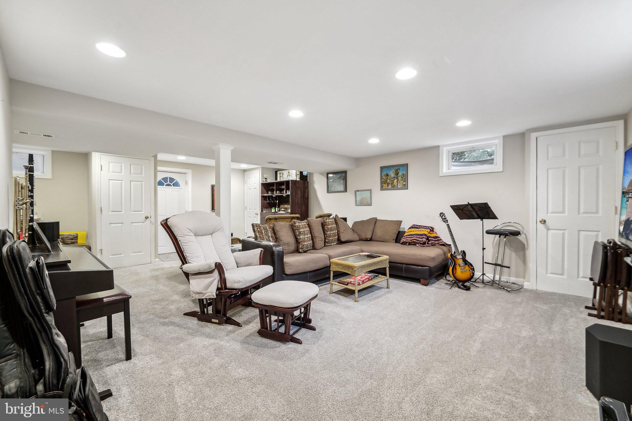 15516 Tierra Drive Silver Spring, MD 20906 - Photo 34 of 62 a living room with furniture and a gym machine