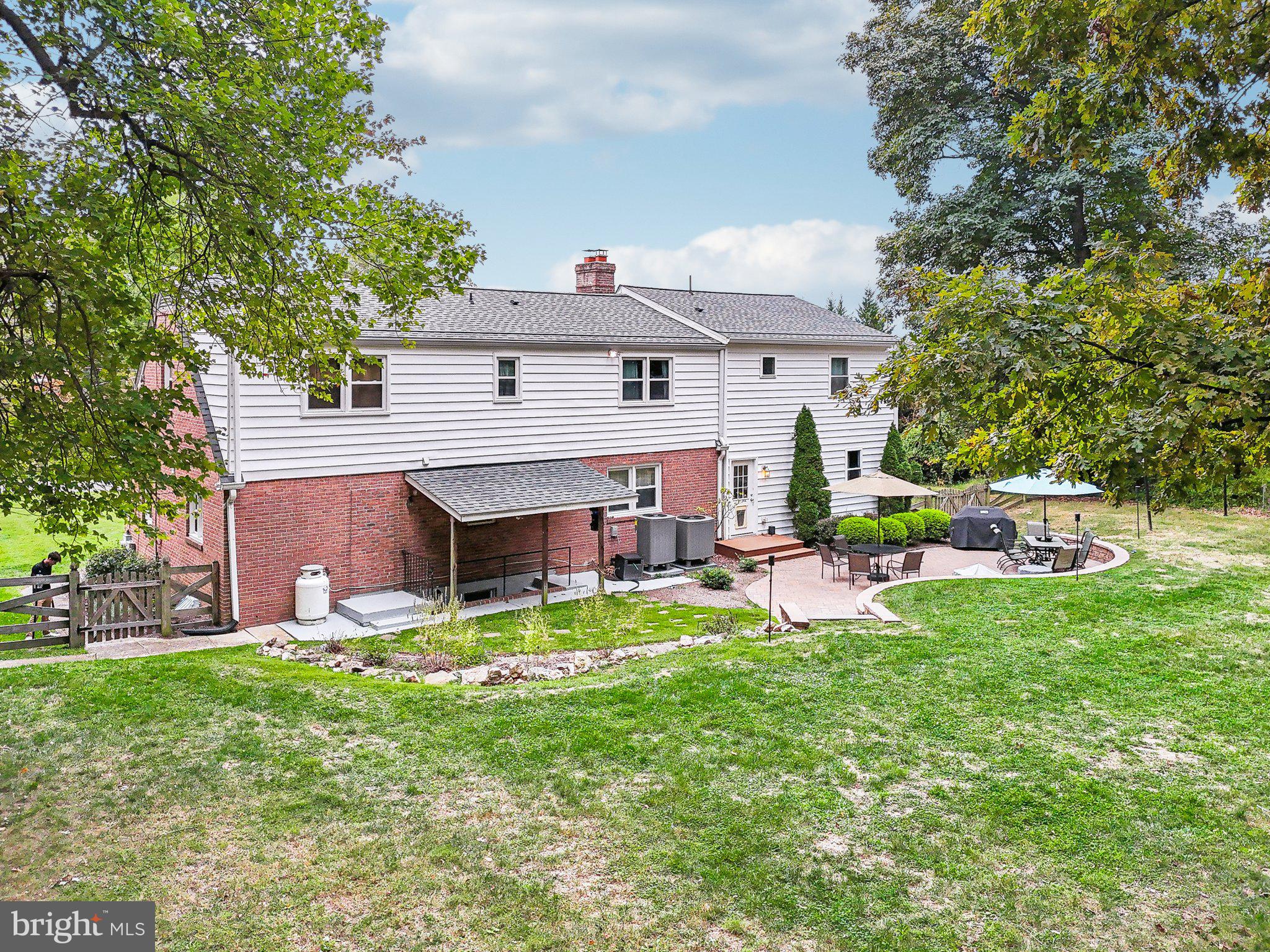 15516 Tierra Drive Silver Spring, MD 20906 - Photo 38 of 62 a view of a house with a yard and sitting area