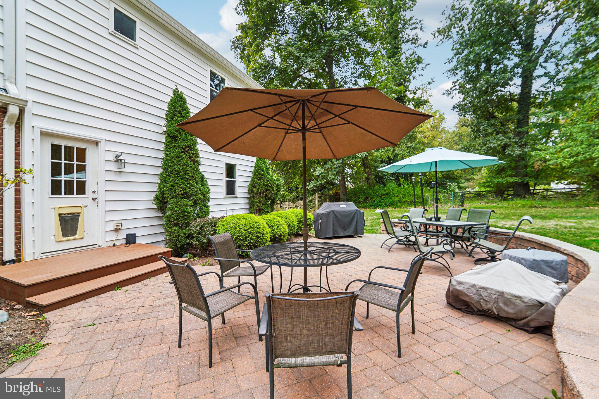 15516 Tierra Drive Silver Spring, MD 20906 - Photo 51 of 62 a view of backyard with outdoor seating and trees