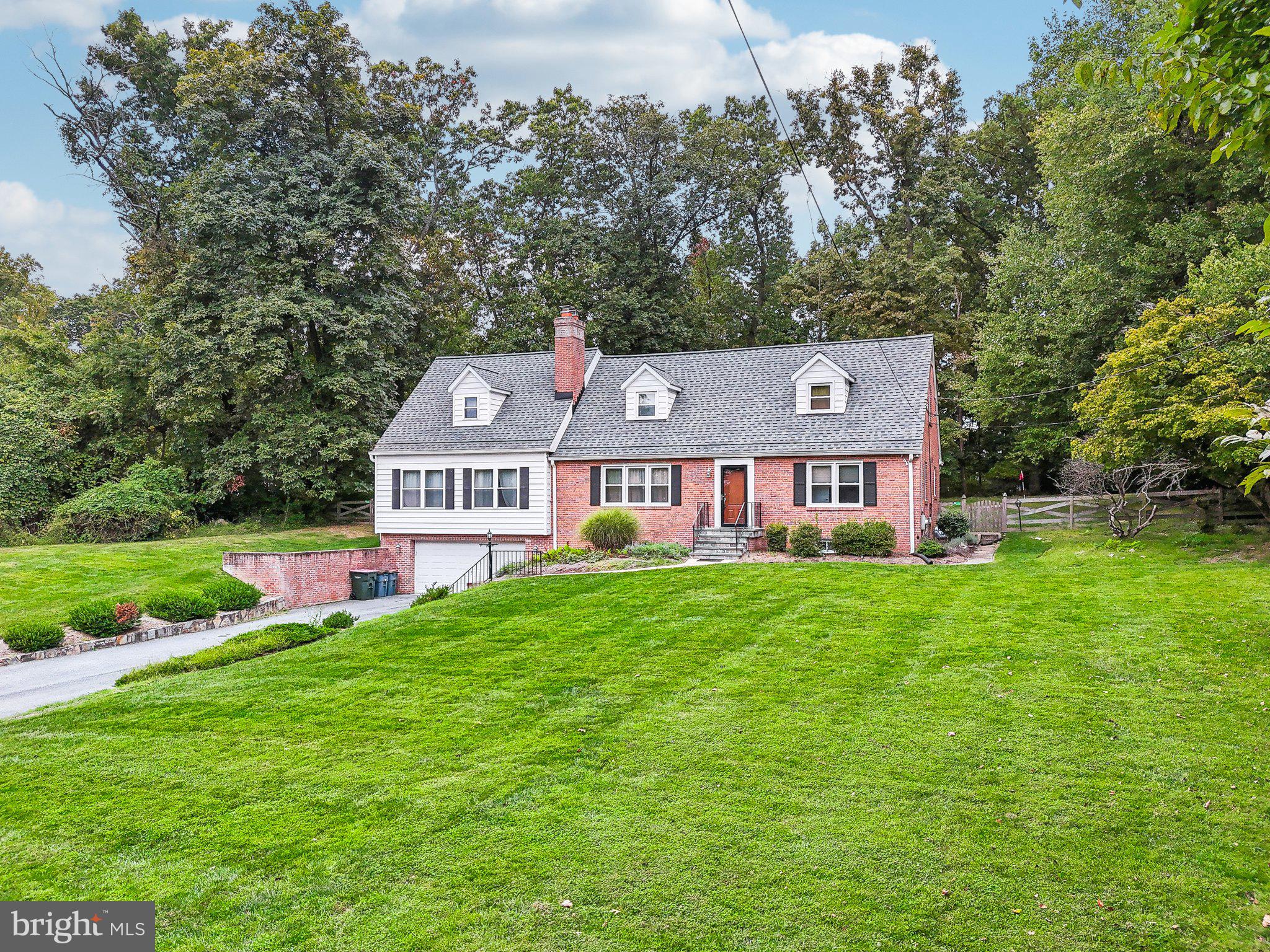 15516 Tierra Drive Silver Spring, MD 20906 - Photo 54 of 62 a front view of a house with garden
