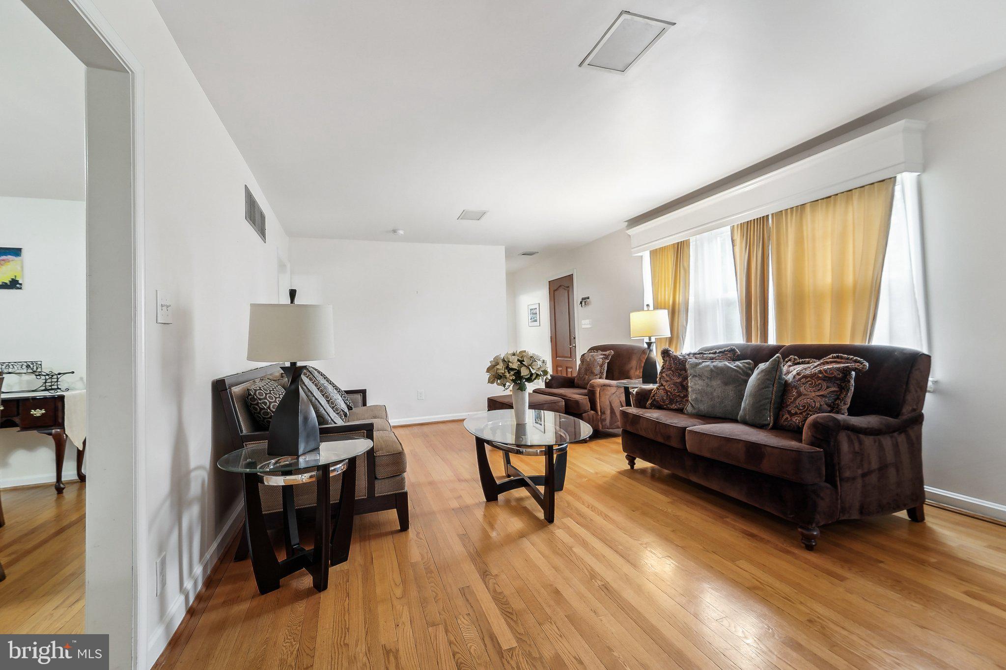 15516 Tierra Drive Silver Spring, MD 20906 - Photo 7 of 62 a living room with furniture and a wooden floor