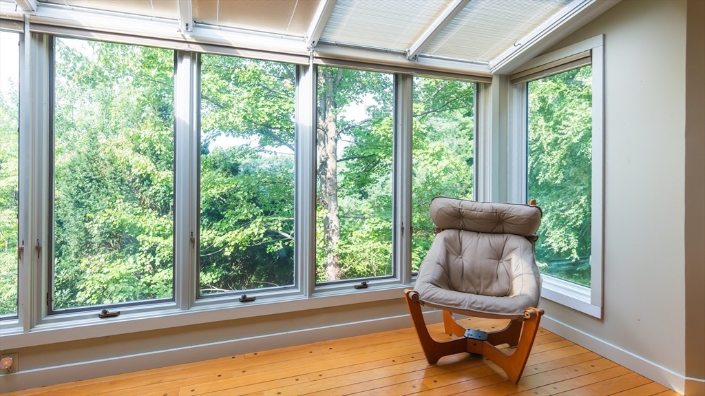 1 Long Plain Road Leverett, MA 01054 - Photo 19 of 39 a living room with a floor to ceiling window and wooden floor
