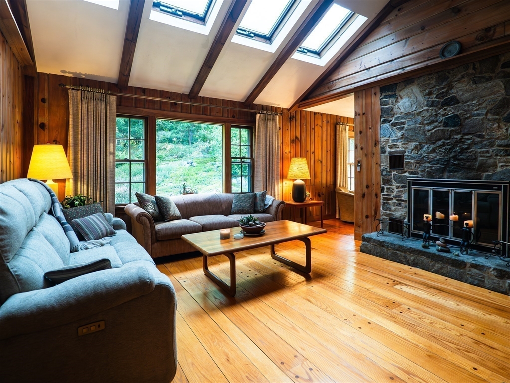 1 Long Plain Road Leverett, MA 01054 - Photo 2 of 39 a living room with furniture a fireplace and a table