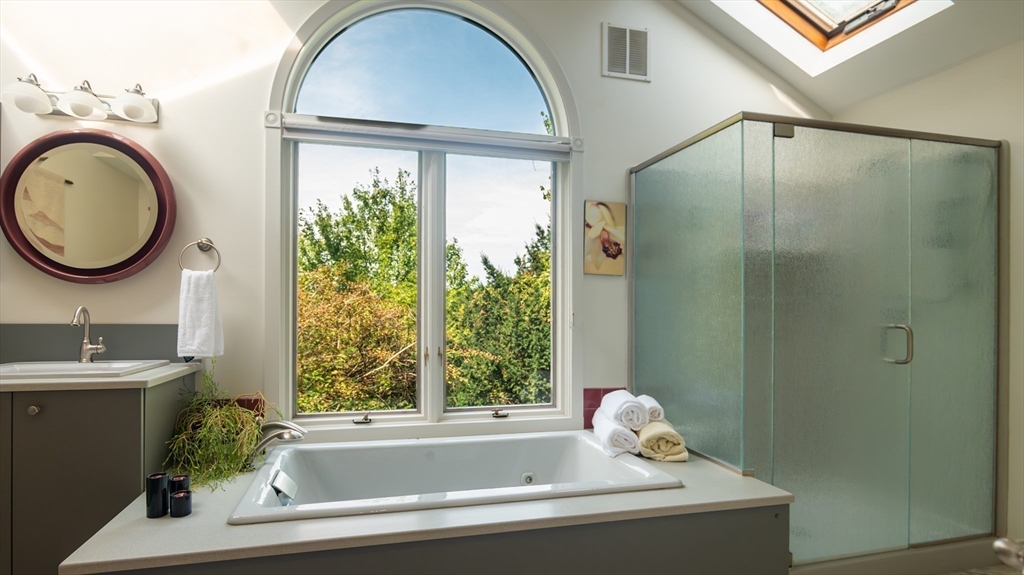 1 Long Plain Road Leverett, MA 01054 - Photo 21 of 39 a bathroom with a tub a sink and a window