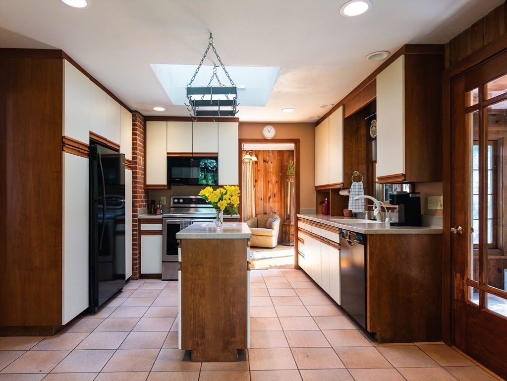 1 Long Plain Road Leverett, MA 01054 - Photo 10 of 39 a kitchen with stainless steel appliances granite countertop a refrigerator a oven a sink a counter top space and living room view
