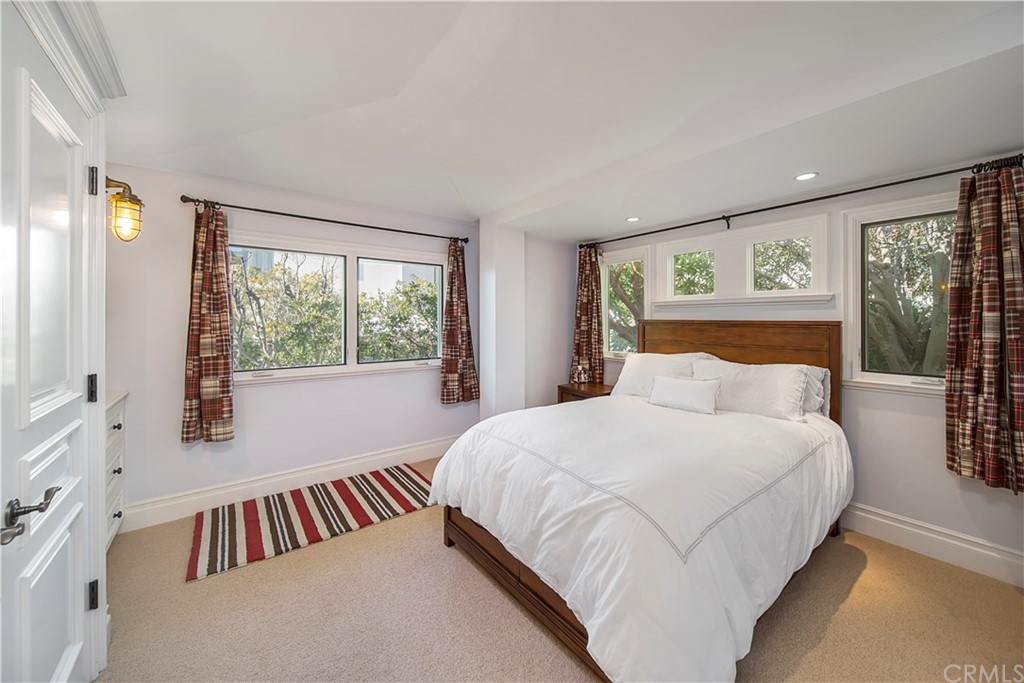 822 Emerald Bay Laguna Beach, CA 92651 - Photo 11 of 25 a bedroom with a bed and large window