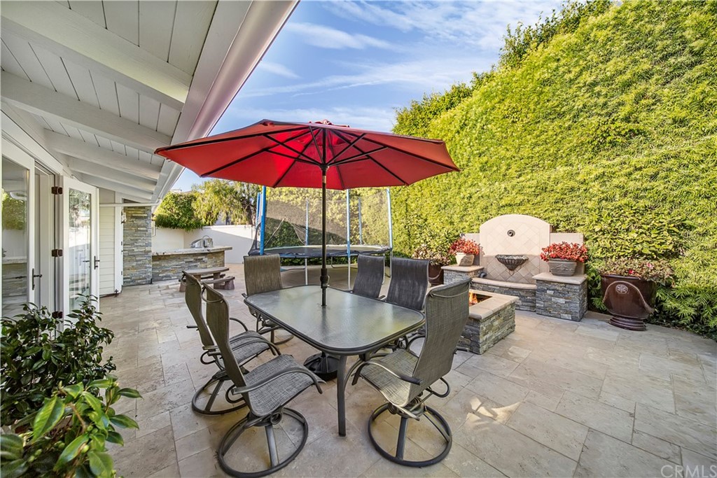 822 Emerald Bay Laguna Beach, CA 92651 - Photo 14 of 25 a view of a table and chairs under an umbrella in patio