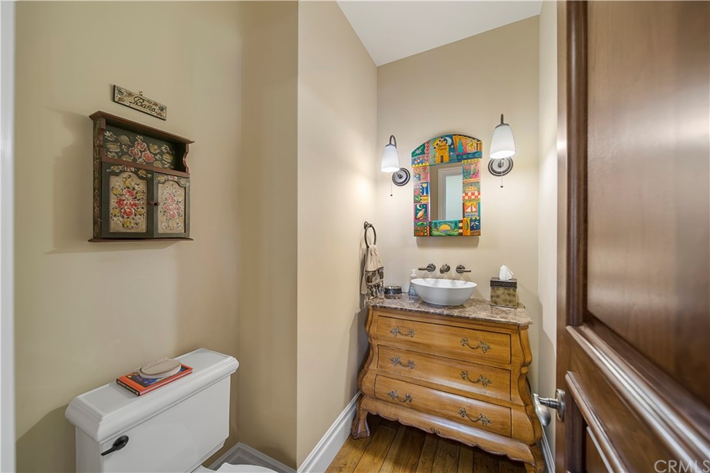 822 Emerald Bay Laguna Beach, CA 92651 - Photo 21 of 25 a bathroom with a sink mirror and toilet