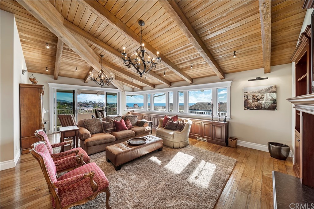 822 Emerald Bay Laguna Beach, CA 92651 - Photo 24 of 25 a living room with furniture ceiling fan and a rug