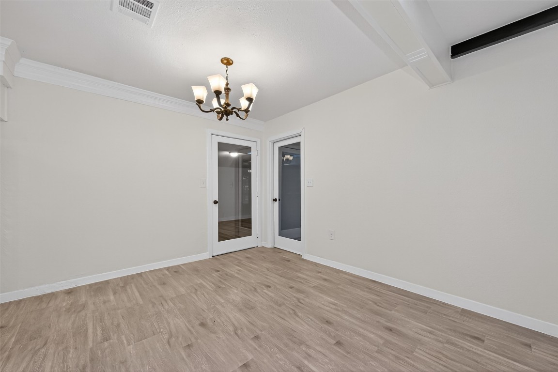 7718 Morley Street Houston, TX 77061 - Photo 17 of 45 wooden floor in an empty room