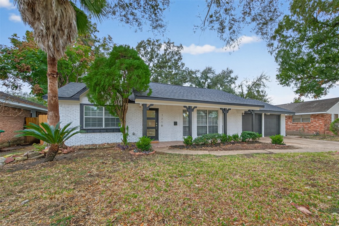 7718 Morley Street Houston, TX 77061 - Photo 3 of 45 a front view of house with yard and green space