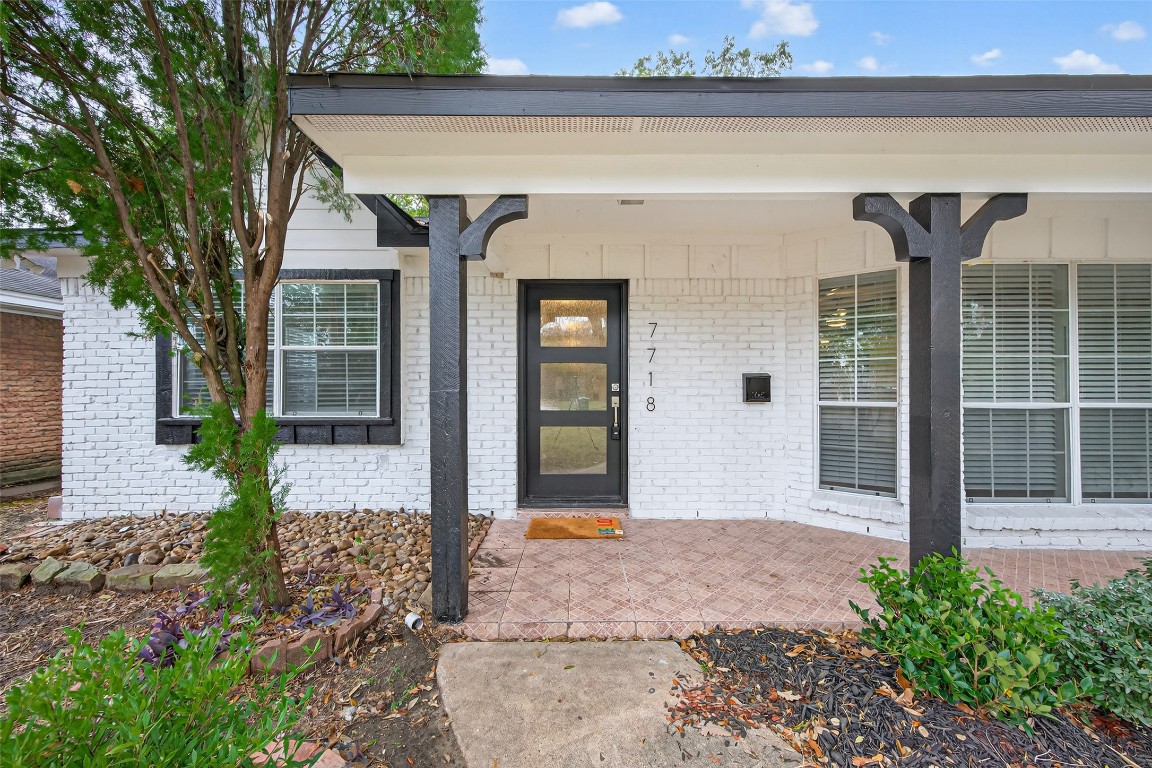 7718 Morley Street Houston, TX 77061 - Photo 8 of 45 a front view of a house with garden