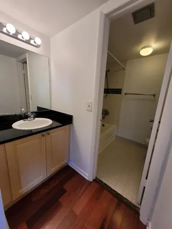 a kitchen with a sink and a refrigerator