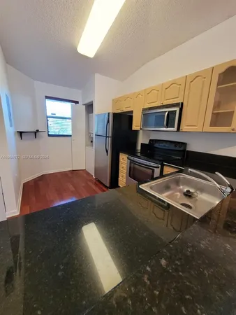 a bedroom with furniture and natural light