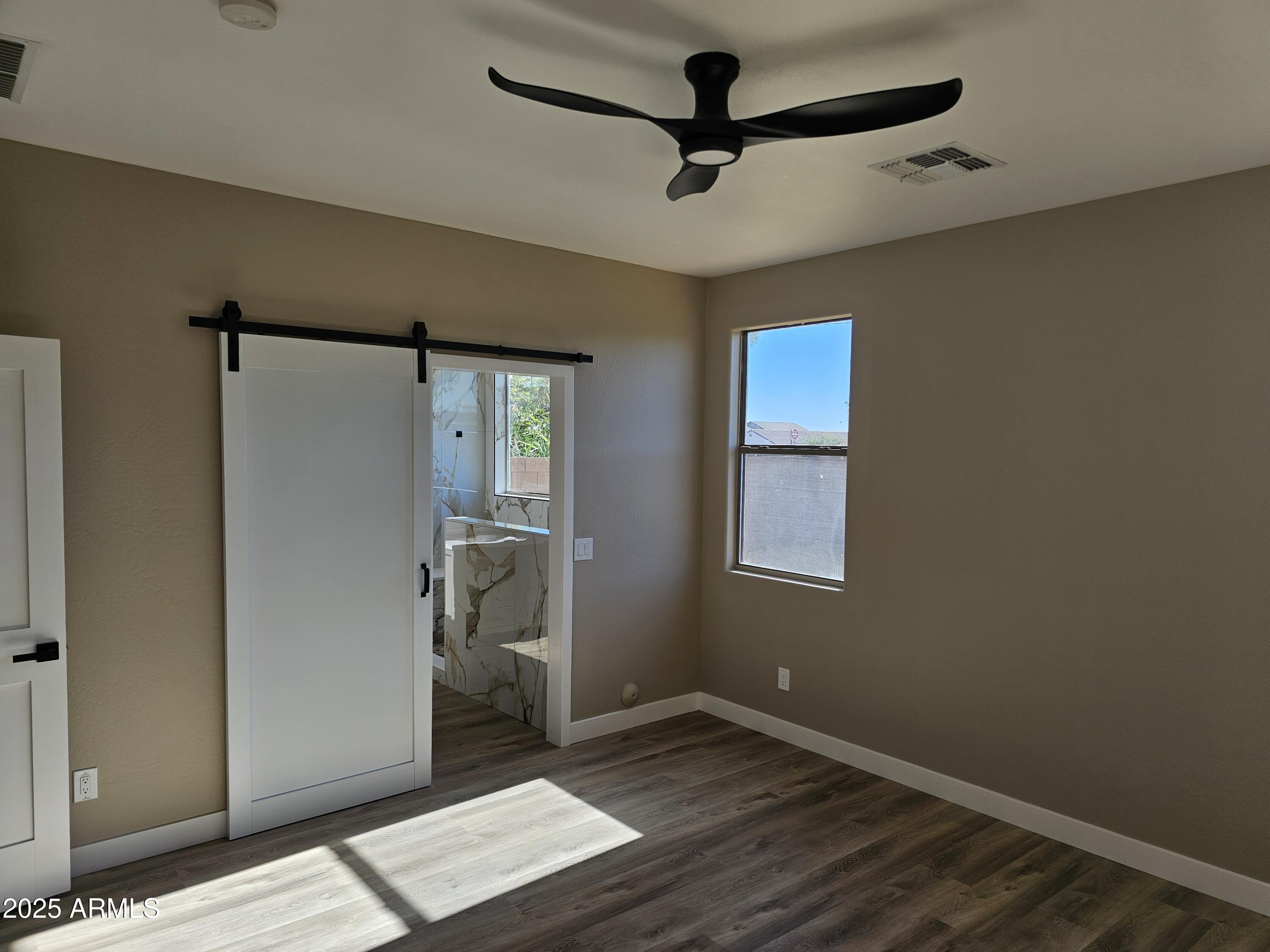 14279 West Boca Raton Road Surprise, AZ 85379 - Photo 14 of 21 Primary bedroom