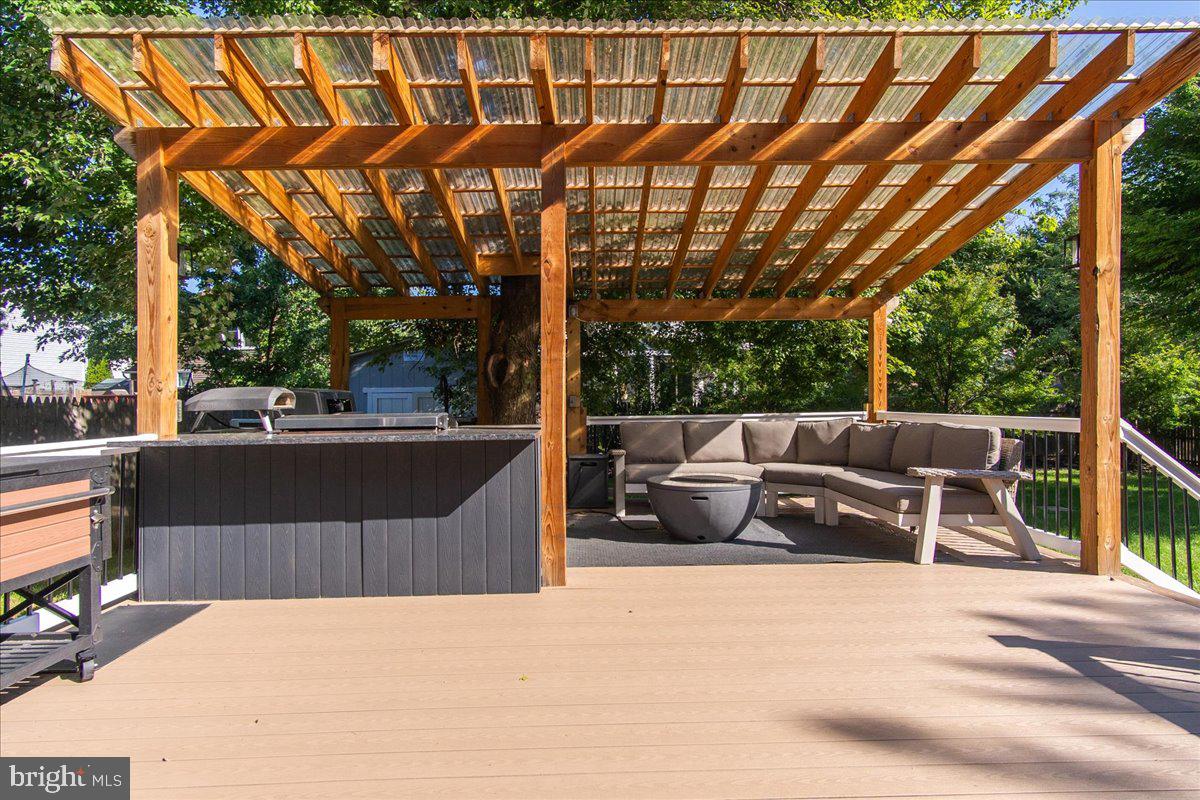 1201 Schaffer Drive Frederick, MD 21702 - Photo 7 of 46 Large deck with outdoor kitchen