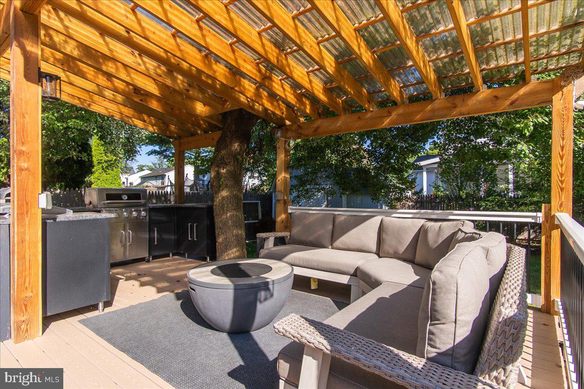 1201 Schaffer Drive Frederick, MD 21702 - Photo 8 of 46 Large deck with outdoor kitchen