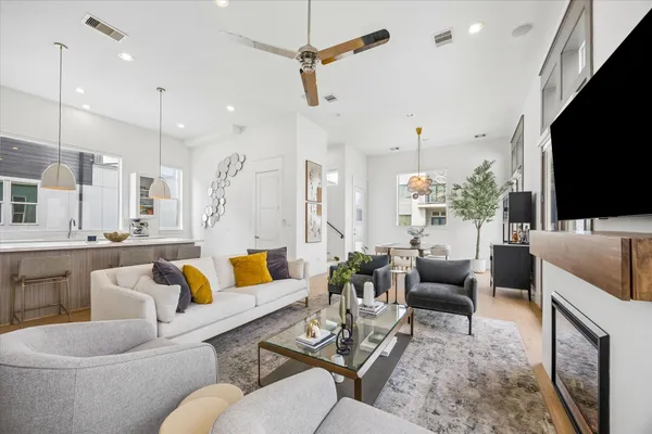a living room with furniture fireplace and a flat screen tv