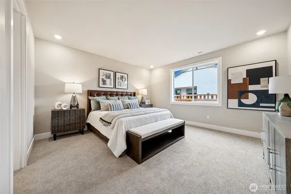 a spacious bedroom with a bed and a window