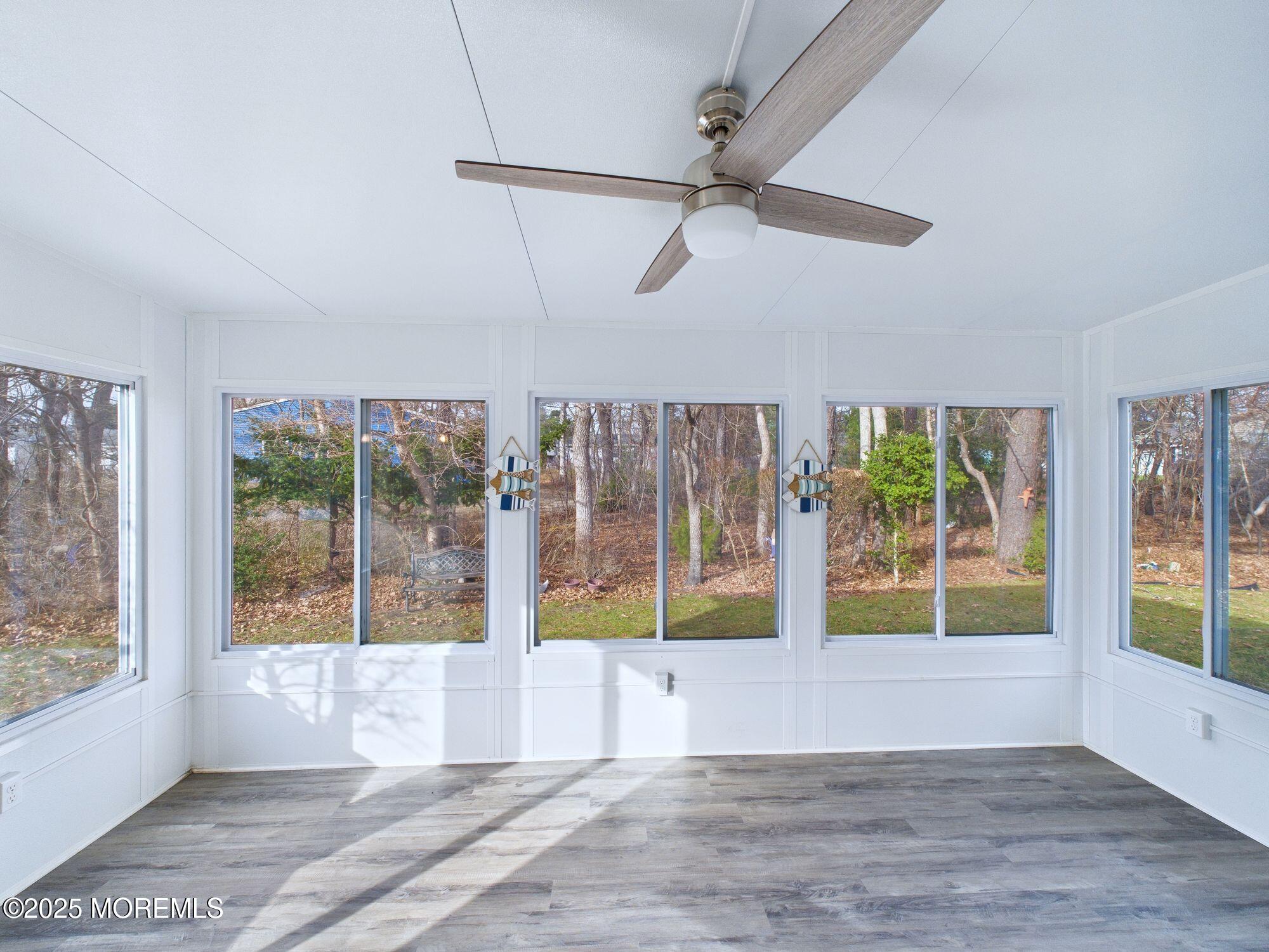 10 Hartford Road Manchester Township, NJ 08759 - Photo 20 of 35 a view of an empty room with wooden floor and a window