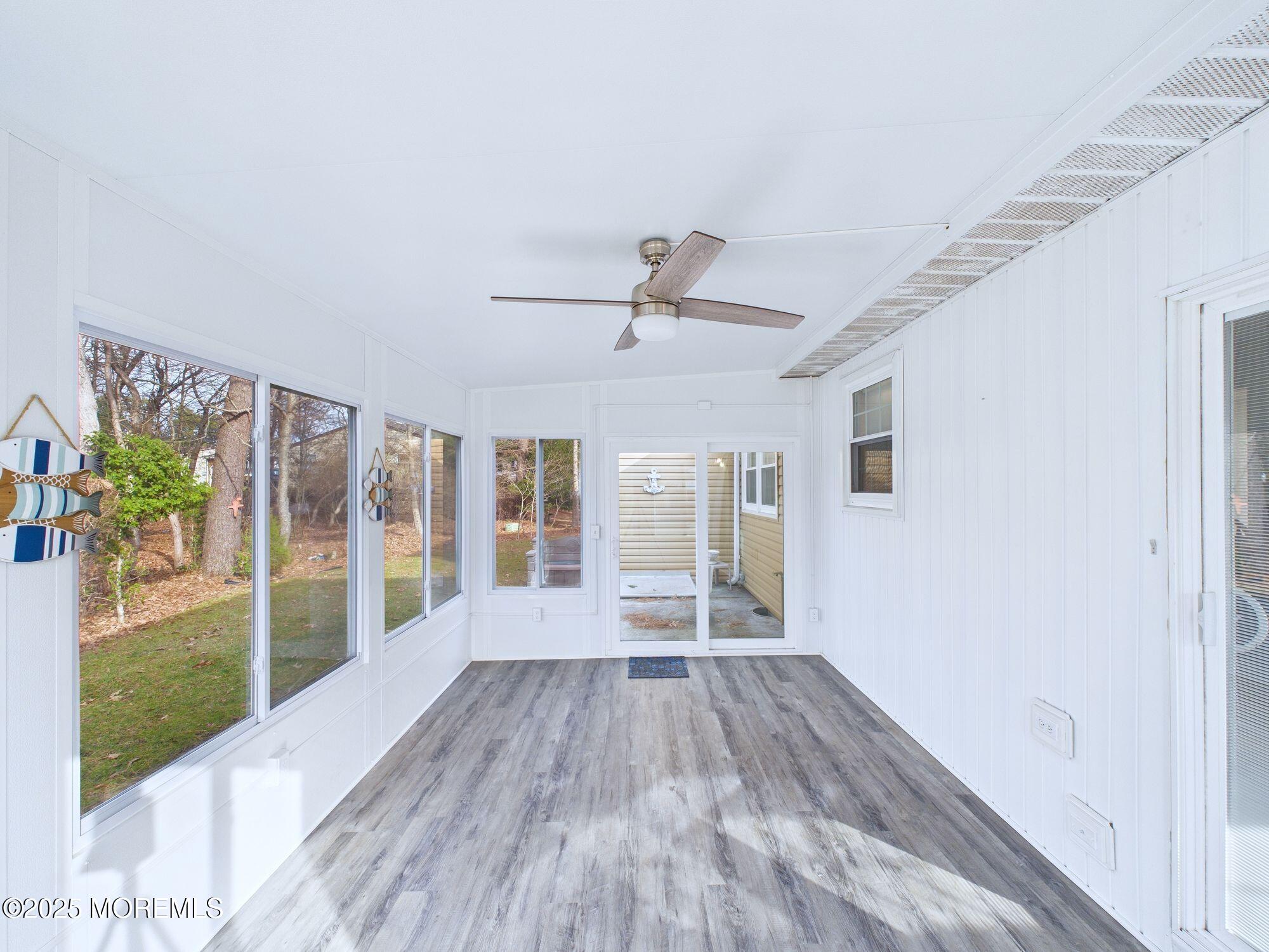10 Hartford Road Manchester Township, NJ 08759 - Photo 21 of 35 a view of empty room with wooden floor and fan