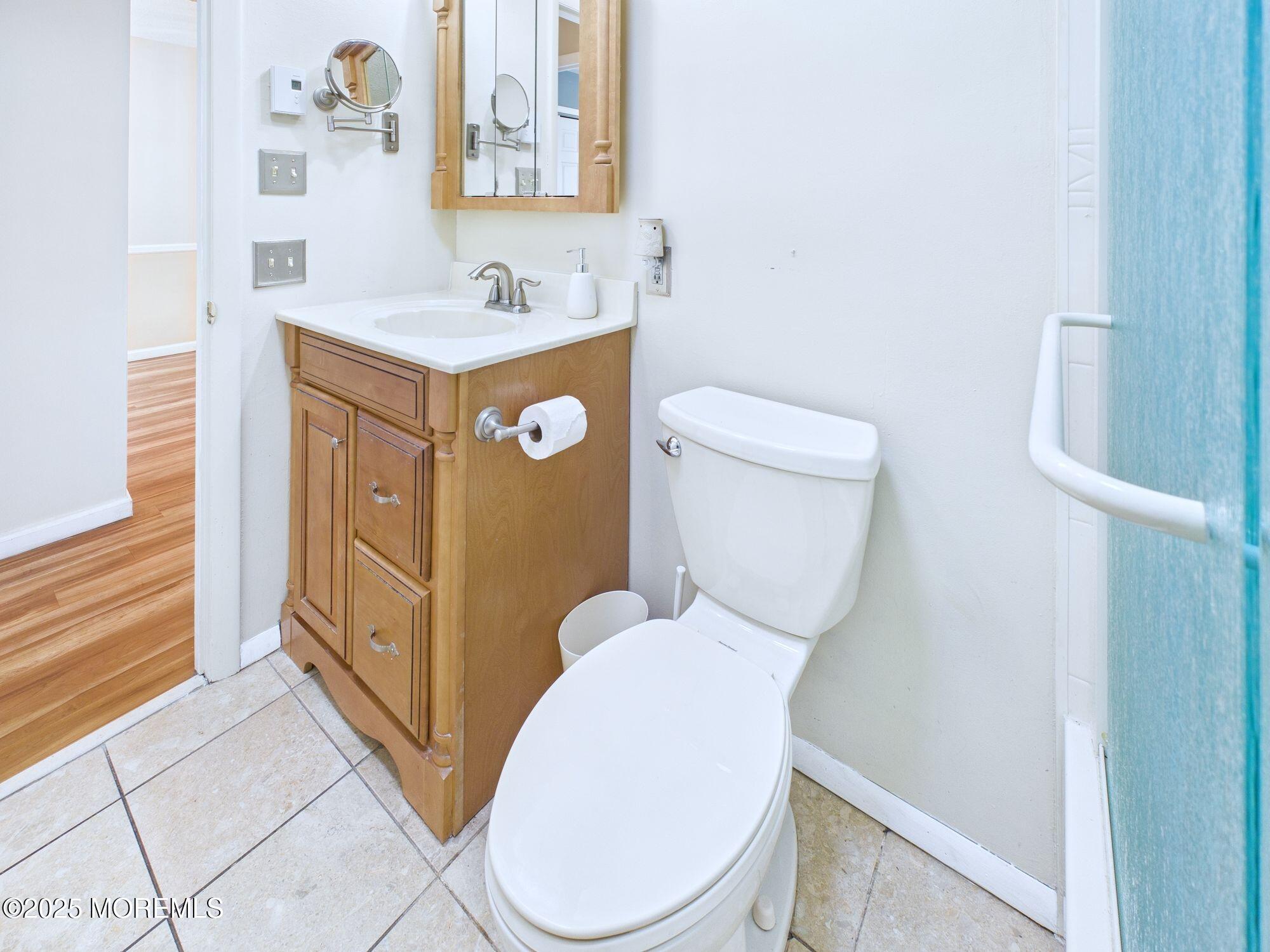 10 Hartford Road Manchester Township, NJ 08759 - Photo 27 of 35 a bathroom with a granite countertop toilet and a sink