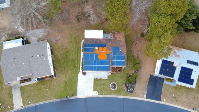 an aerial view of residential houses with outdoor space