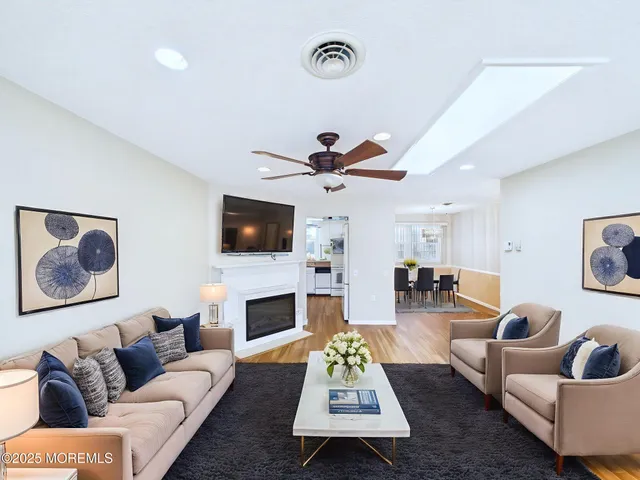 a living room with furniture fireplace and window