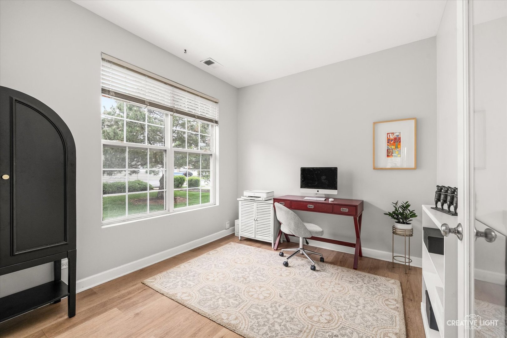 24019 Pear Tree Circle Plainfield, IL 60585 - Photo 12 of 20 a workspace with furniture and a window