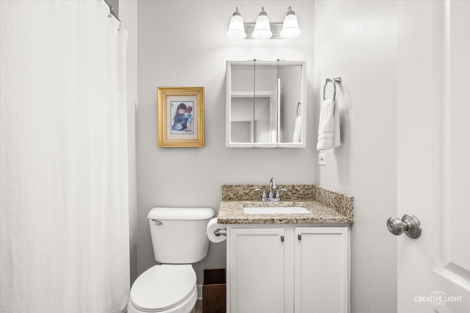 24019 Pear Tree Circle Plainfield, IL 60585 - Photo 17 of 20 a bathroom with a toilet sink and mirror