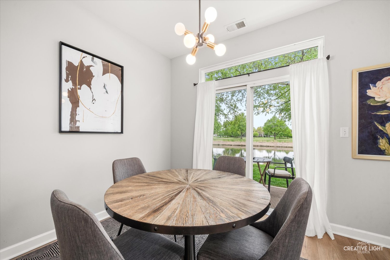 24019 Pear Tree Circle Plainfield, IL 60585 - Photo 7 of 20 a dining room with furniture and a large window