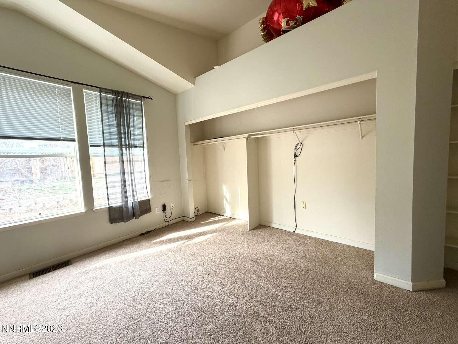4695 Hampton Lane Reno, NV 89519 - Photo 7 of 20 a view of an empty room with a window