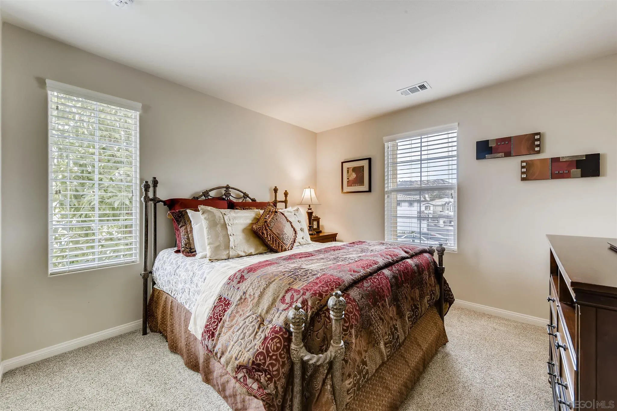 8629 Orchard Bloom Way El Cajon, CA 92021 - Photo 12 of 19 a bedroom with a bed and a window
