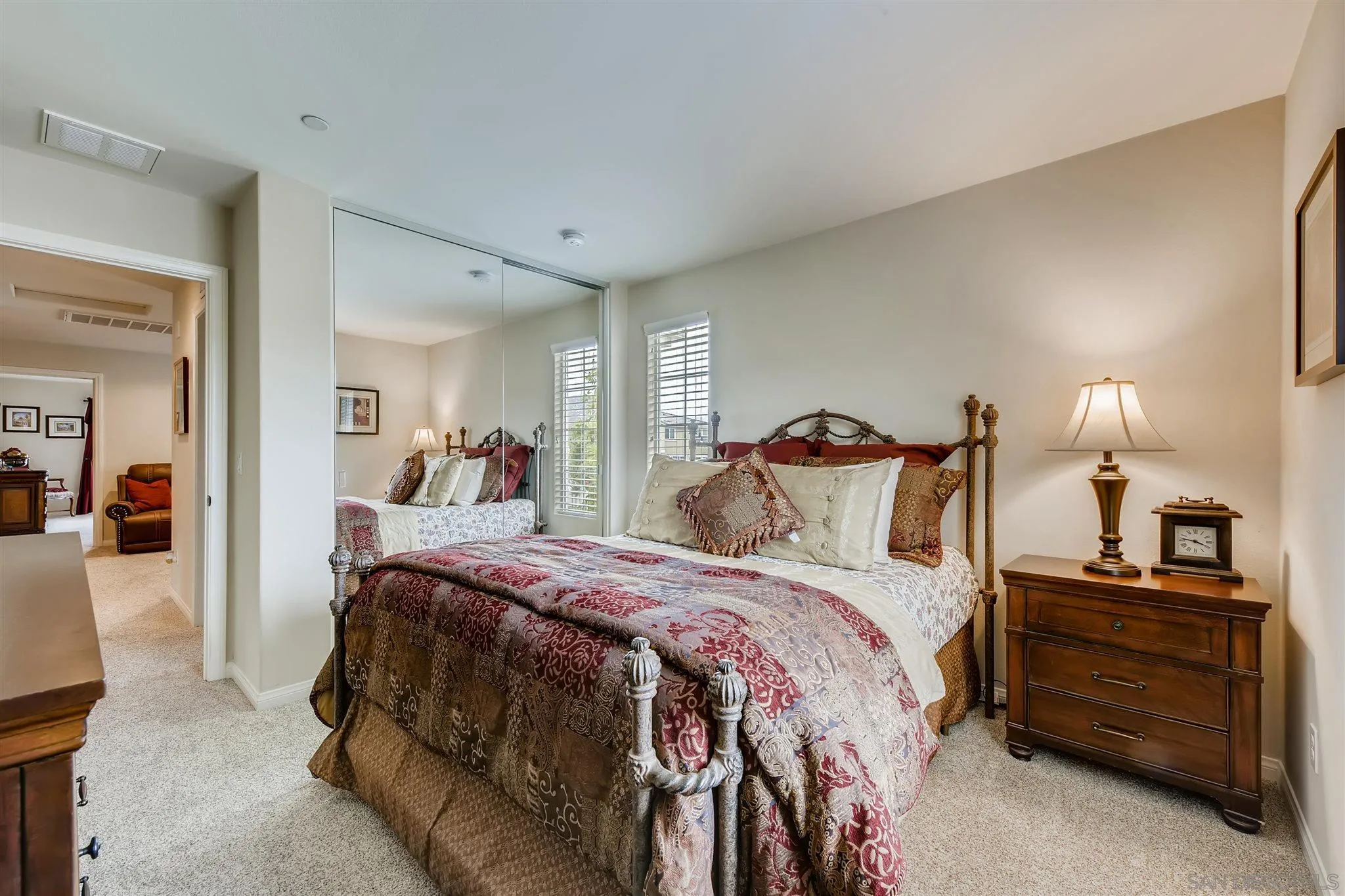 8629 Orchard Bloom Way El Cajon, CA 92021 - Photo 13 of 19 a bedroom with a bed and a lamp on dresser