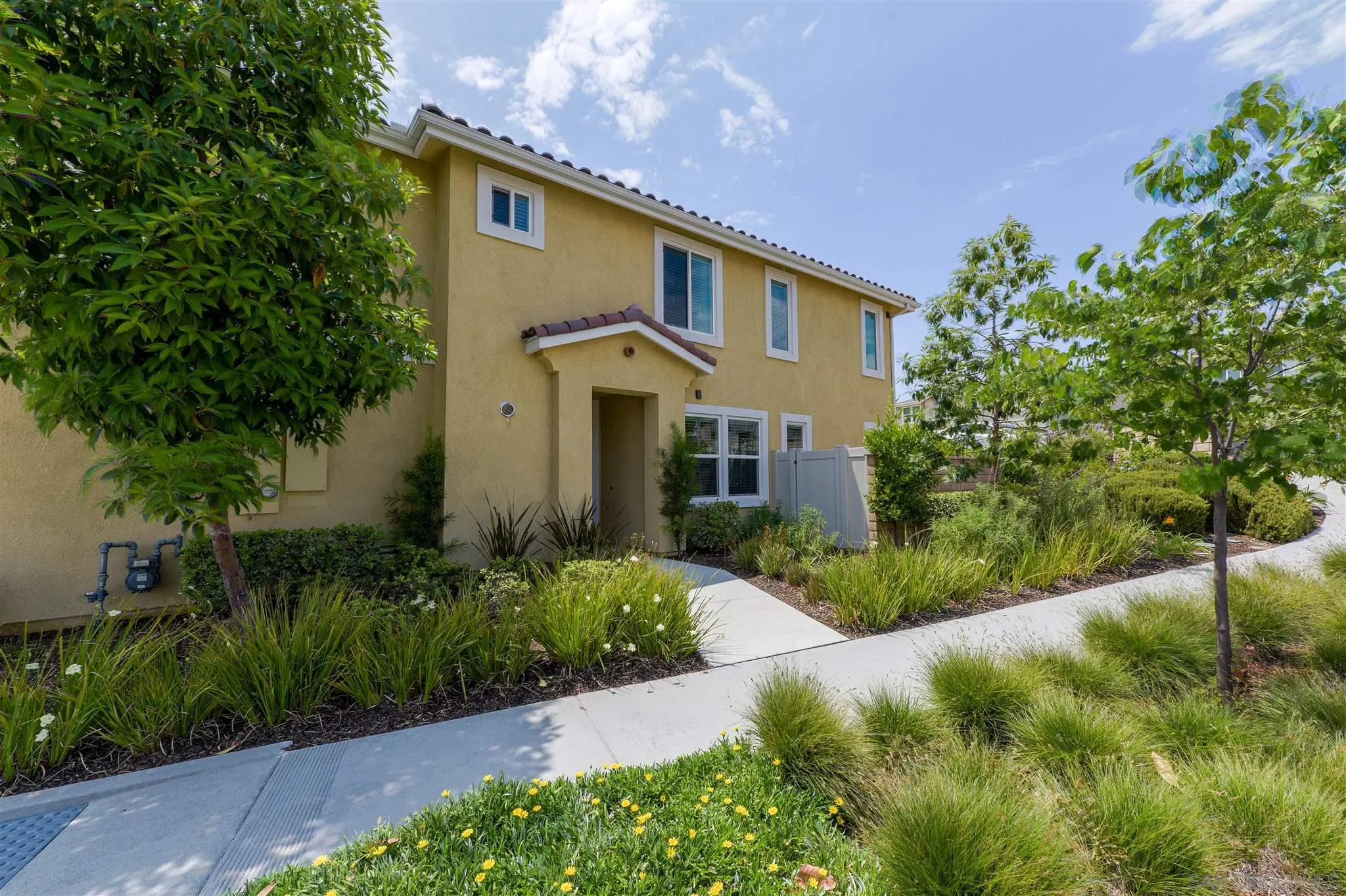 8629 Orchard Bloom Way El Cajon, CA 92021 - Photo 17 of 19 a front view of a house with a yard