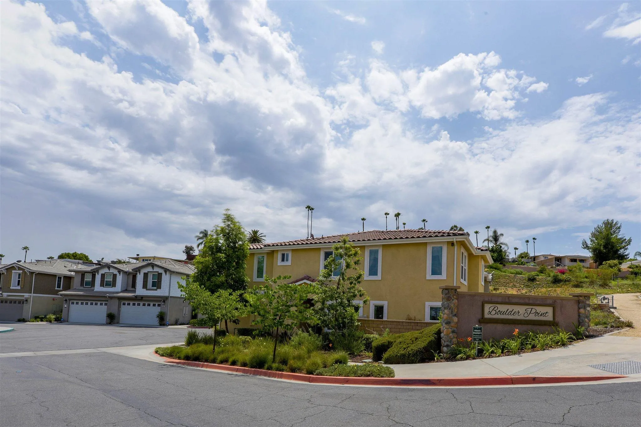 8629 Orchard Bloom Way El Cajon, CA 92021 - Photo 18 of 19 a view of a house with a yard and potted plants